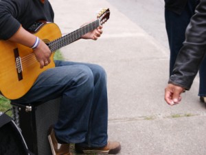 guitarist playing for money © iStockPhoto.com/WoodenDinosaur